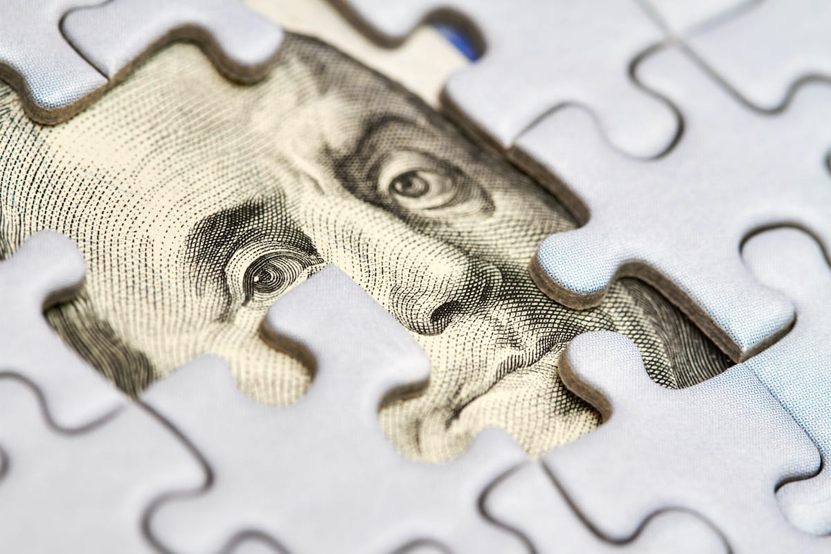 Puzzle with Dollar underneath